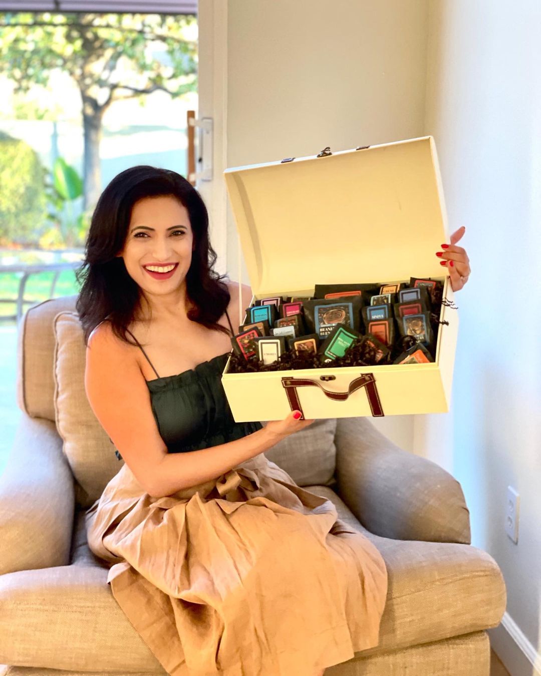 Image of Woman holding Deluxe Coffee Trunk Gift Basket